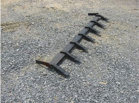 cat skid steer tooth bar|front end loader teeth bars.